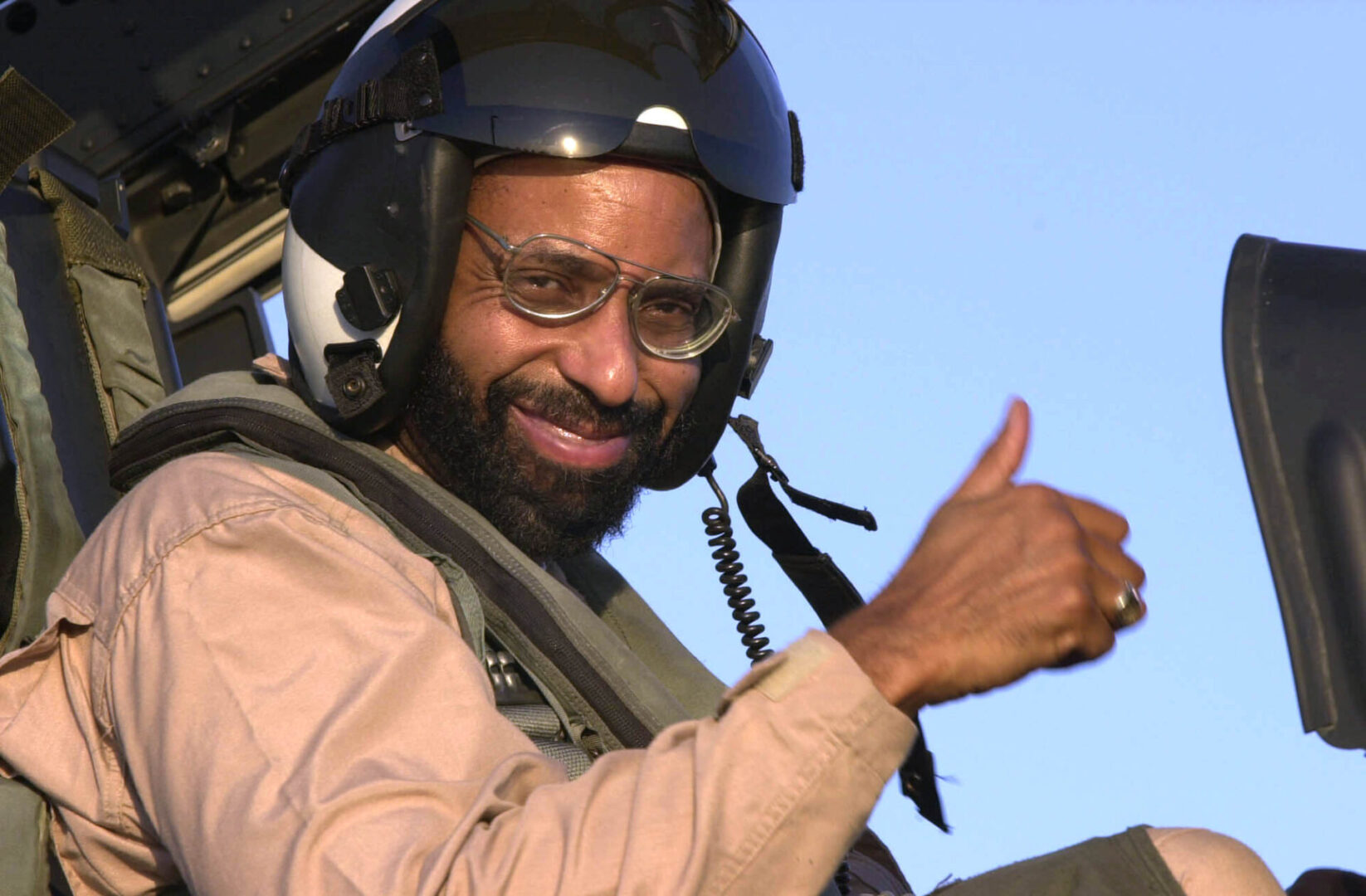 030831-N-9319H-006
Central Command Area of Responsibility (Aug. 31, 2003) -- The Honorable Richard L. Baltimore, US Ambassador to Oman, gives a thumbs up following a flight in an F/A-18F Super Hornet assigned to the ÒBlack AcesÓ of Fixed Wing Strike Fighter Squadron Forty One (VFA-41), on the flight deck aboard USS Nimitz (CVN 68).  Nimitz Strike Group and her embarked Carrier Air Wing Eleven (CVW-11) are deployed in support of Operation Iraqi Freedom, the multi-national coalition effort to liberate the Iraqi people, eliminate IraqÕs weapons of mass destruction, and end the regime of Saddam Hussein. U.S. Navy photo by Airman Angel G Hilbrands.  (RELEASED)