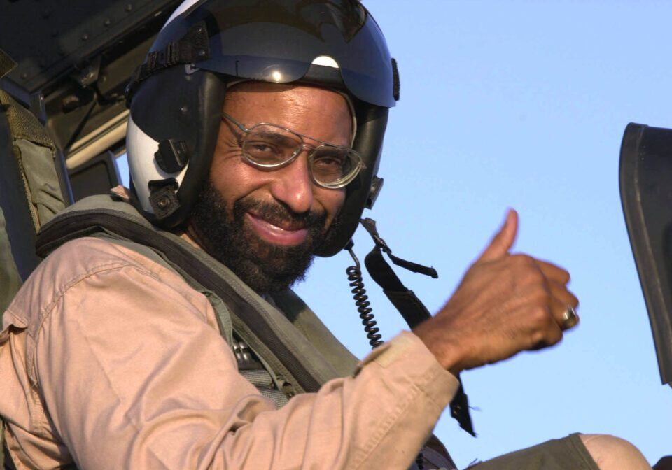 030831-N-9319H-006
Central Command Area of Responsibility (Aug. 31, 2003) -- The Honorable Richard L. Baltimore, US Ambassador to Oman, gives a thumbs up following a flight in an F/A-18F Super Hornet assigned to the ÒBlack AcesÓ of Fixed Wing Strike Fighter Squadron Forty One (VFA-41), on the flight deck aboard USS Nimitz (CVN 68).  Nimitz Strike Group and her embarked Carrier Air Wing Eleven (CVW-11) are deployed in support of Operation Iraqi Freedom, the multi-national coalition effort to liberate the Iraqi people, eliminate IraqÕs weapons of mass destruction, and end the regime of Saddam Hussein. U.S. Navy photo by Airman Angel G Hilbrands.  (RELEASED)